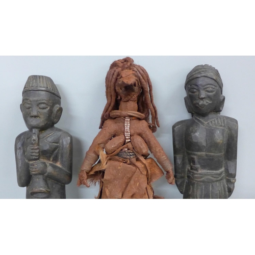 762 - An African leather covered fertility figure, two carved African figures and a carved chillum pipe