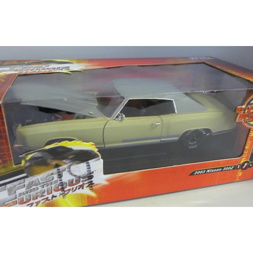 769 - A 1/18 scale Fast and Furious model car, 2003 Nissan 350Z and one other in associated box