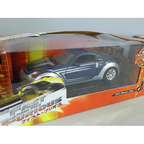 769 - A 1/18 scale Fast and Furious model car, 2003 Nissan 350Z and one other in associated box