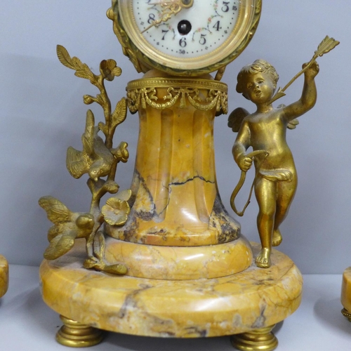 797 - A 19th Century French yellow marble and gilt metal clock garniture, with cupid, the porcelain dial m... 