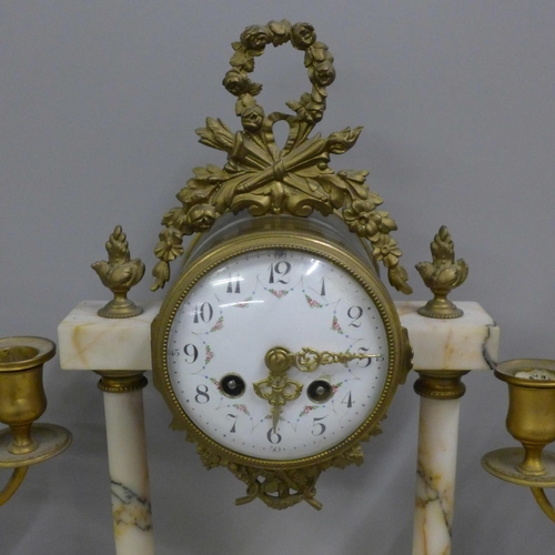 798 - A French white marble and gilt metal clock garniture with porcelain dial, 38cm