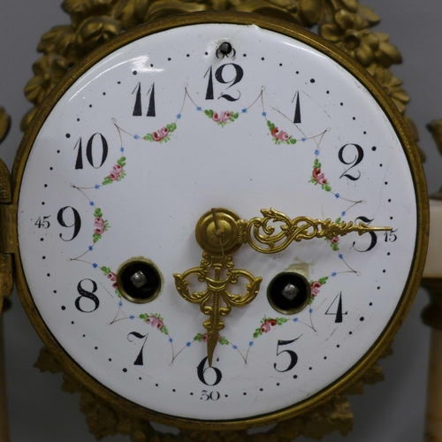 798 - A French white marble and gilt metal clock garniture with porcelain dial, 38cm