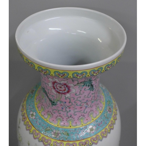 805 - A large Chinese famille rose vase decorated with peacocks, 60cm