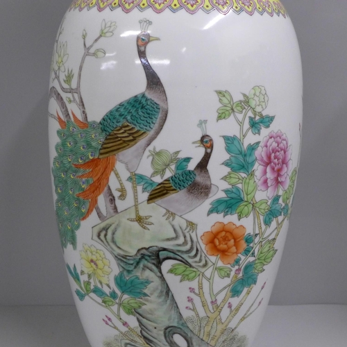 805 - A large Chinese famille rose vase decorated with peacocks, 60cm