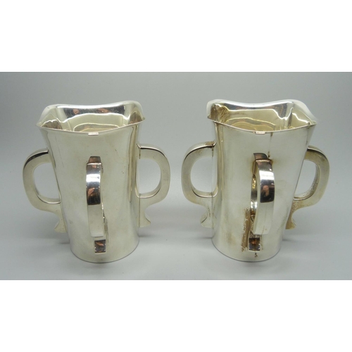 840 - A pair of silver Mappin & Webb Irish Mether four handled vessels, Sheffield 1938, 620g total weight,... 