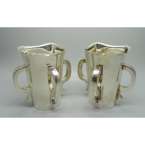 840 - A pair of silver Mappin & Webb Irish Mether four handled vessels, Sheffield 1938, 620g total weight,... 