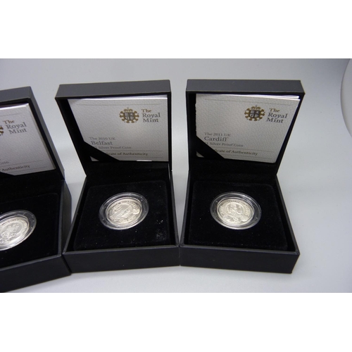 857 - Four The Royal Mint 2010/2011 £1 silver proof coins, London, Belfast, Edinburgh and Cardiff