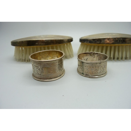 870 - Two silver backed brushes and two silver napkin rings