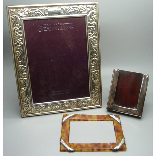 875 - A silver photograph frame, 17cm x 22cm, and two other silver mounted frames