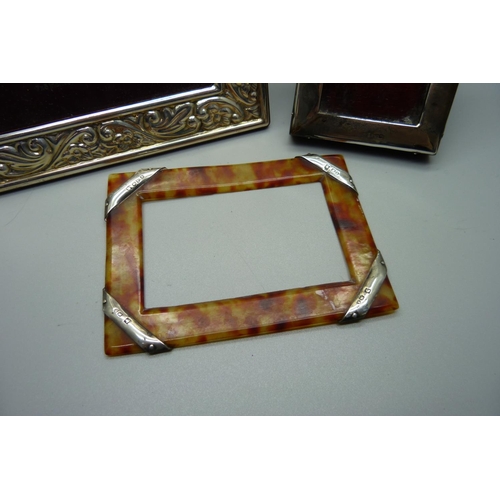 875 - A silver photograph frame, 17cm x 22cm, and two other silver mounted frames