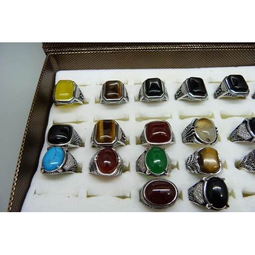 878 - Twenty copper and silver plated gemstone rings