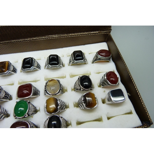 878 - Twenty copper and silver plated gemstone rings