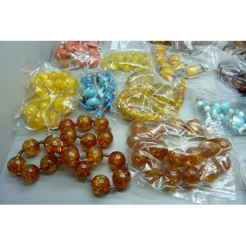 896 - A collection of bead jewellery including amber coloured