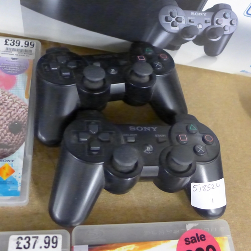 2076 - A Playstation 3 console with 5 games including Little Big Planet and Motorstorm and two Playstation ... 