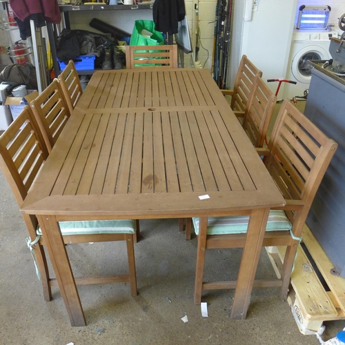 2225 - A teak garden table and 8 chairs