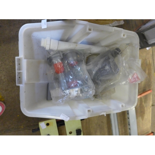 2397 - A tub of mixed plumbing supplies, a bag of sand blasting grit and a bag of play sand