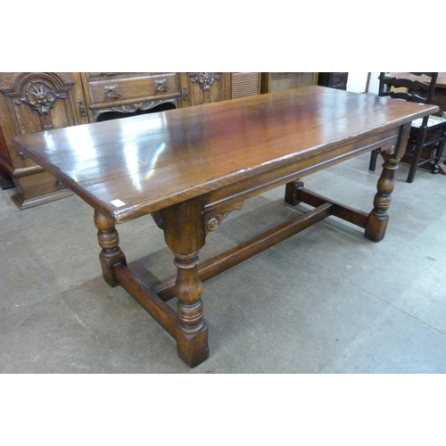 100 - A 17th Century style Ipswich oak refectory table, 75cms h, 183cmsnl, 82cms w