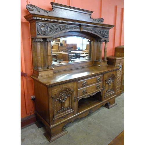 103 - A late Victorian carved oak mirrorback sideboard