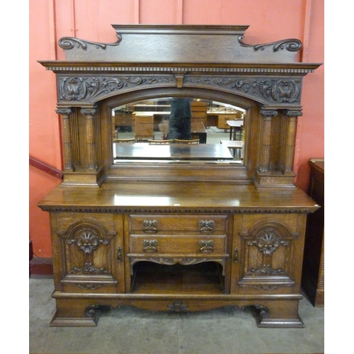 103 - A late Victorian carved oak mirrorback sideboard