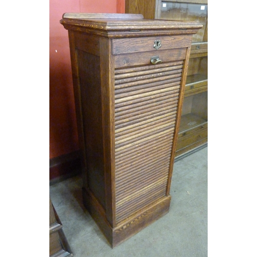 104 - An early 20th Century oak tambour front filing cabinet