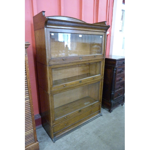 105 - An early 20th Century Lebus oak three tier sectional stacking bookcase