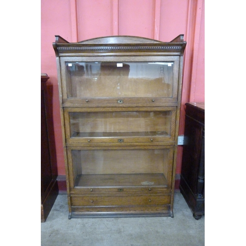 105 - An early 20th Century Lebus oak three tier sectional stacking bookcase