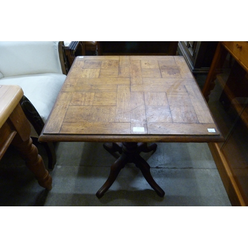 127 - A Victorian oak parquetry topped tea table