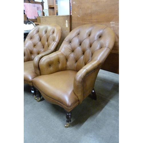 134 - A pair of Regency style tan leather armchairs