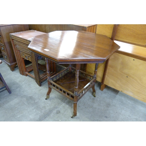 150 - A Victorian Aesthetic Movement rosewood octagonal centre table, H.W. Batley for Gregory & Co. 212 & ... 