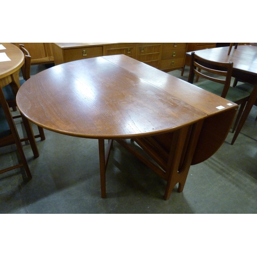 17 - A Jentique teak drop leaf table