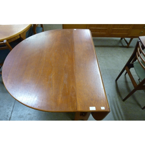 17 - A Jentique teak drop leaf table