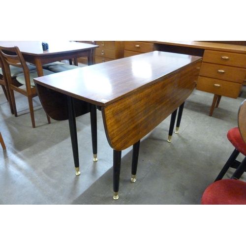 20 - A G-Plan Librenza tola wood and black drop-leaf dining table and two chairs