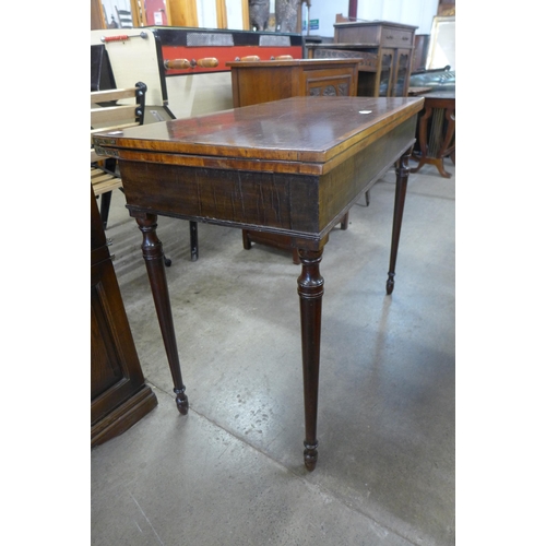 209 - A George IV mahogany rectangular fold over card table