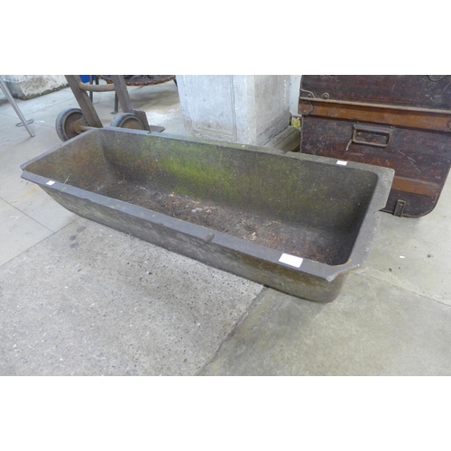 224 - A cast iron feeding trough