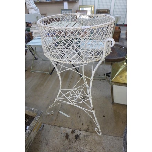 228 - A Victorian painted wrought iron plant stand