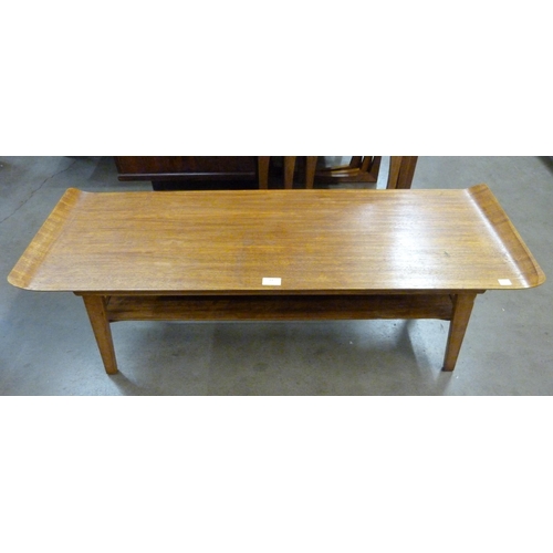 23 - A teak coffee table