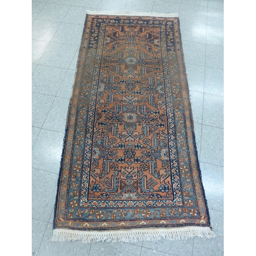 260 - An eastern terracotta ground rug