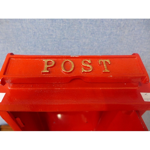 283 - A red painted cast iron wall mounted Post Office letter box, with key