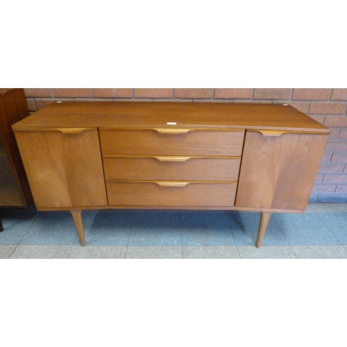 3 - An Austin Suite teak concave sideboard