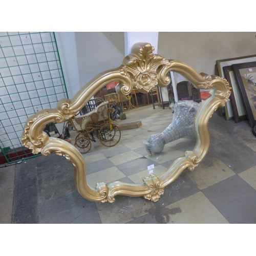 300 - A gilt framed mirror and a bevelled edge mirror