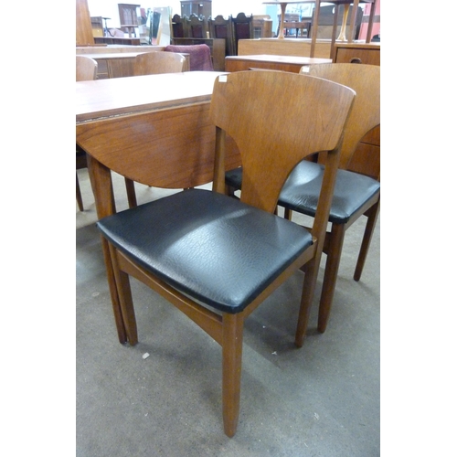 31 - A teak drop-leaf table and four chairs