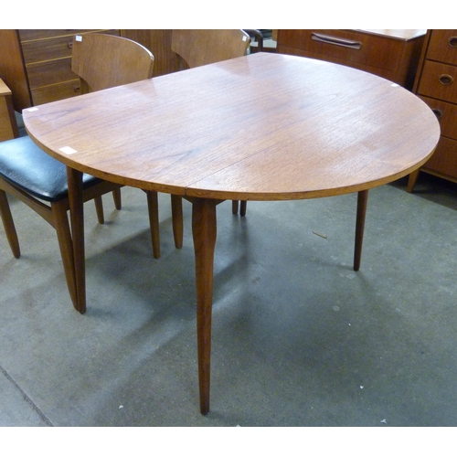 31 - A teak drop-leaf table and four chairs