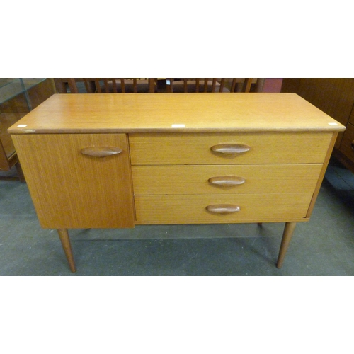 32 - A small teak sideboard