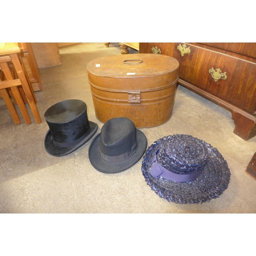 326 - A hat box including a top hat, bowler hat and others