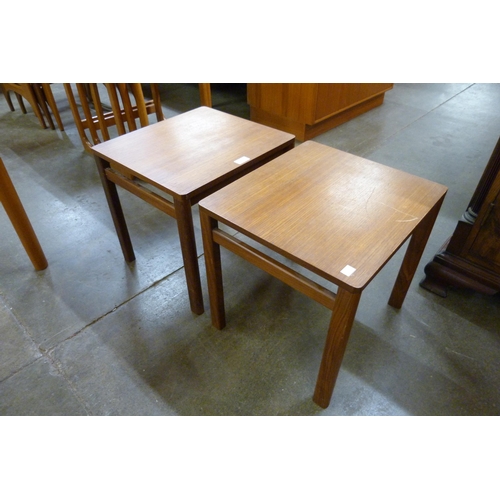 34 - A pair of teak occasional tables