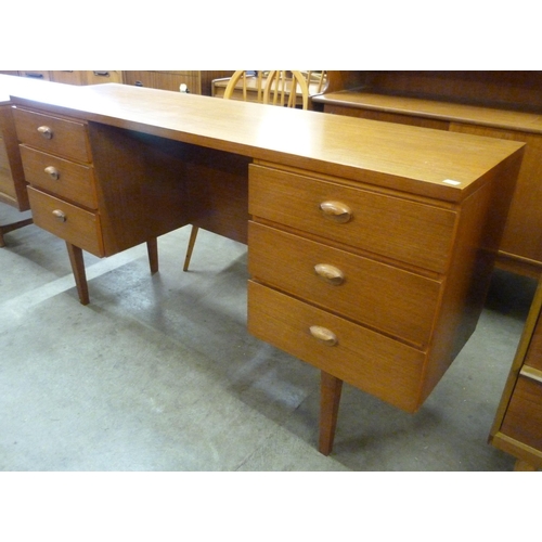 64 - An Austin Suite teak desk