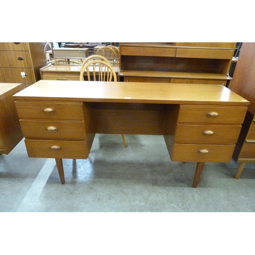 64 - An Austin Suite teak desk