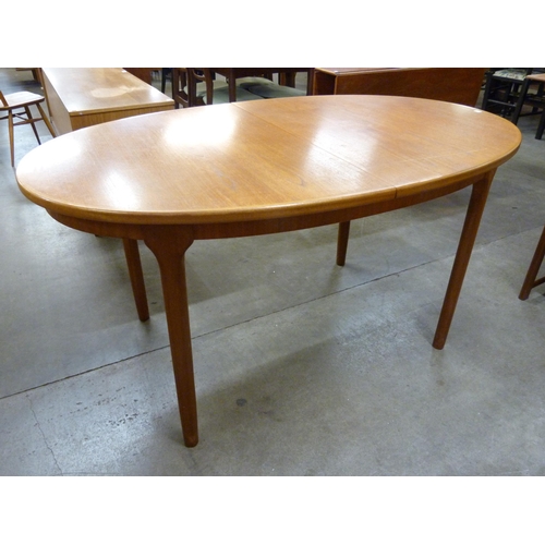 66 - A McIntosh teak extending dining table