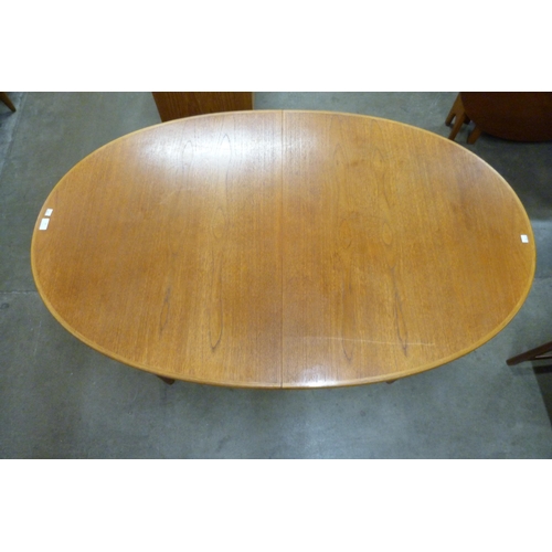 66 - A McIntosh teak extending dining table