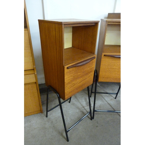 72 - A pair of teak cabinets on black metal stands